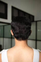 Wall Mural - the black hair of an Asian man from behind