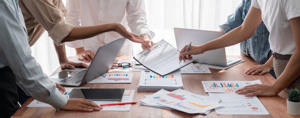 Aufkleber - Analyst team utilizing BI Fintech to analyze and pointing at financial dashboard paper office. Businesspeople examining report paper on table for business insight. Panorama shot. Scrutinize
