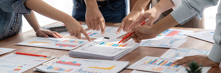 Aufkleber - Analyst team utilizing BI Fintech to analyze and pointing at financial dashboard paper office. Businesspeople examining report paper on table for business insight. Panorama shot. Scrutinize