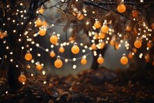 A Magical Background For Halloween With Garlands With Orange Bokeh Lights. Mystical Night Forest In All Saints Day. Copy Space For Text