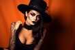 © Anatolii - A girl in stylish top hat with skull make up and tattoo on arm. Halloween party