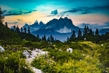 Hiking trail at Sorapis lake with mystic view on Cadini di Misurina in the background in the evening. Lake Sorapis, Dolomites, Belluno, Italy, Europe.