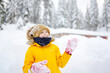 © Maria Sbytova - Happy preteen boy having fun playing with fresh snow during vacation in european Alps. Child dressed in warm clothes, hat, hand gloves and scarf.
