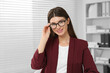 © New Africa - Happy woman in glasses having online video call at home, view from web camera