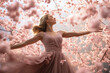 Ballet in Bloom: A Graceful Ballerina Twirls Amidst a Field of Cherry Blossom Petals, a Dazzling Dance of Nature and Artistry.


