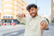 © luismolinero - Young Arabian handsome man at outdoors points finger at you while smiling
