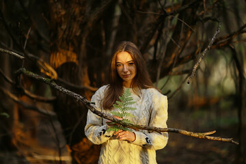 Wall Mural - sad girl in autumn park, stress loneliness young person female