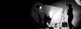 Fototapeta Łazienka - Silhouette of video production behind the scenes or B roll or making of TV commercial movie that film crew team lightman and cameraman working together with director in big studio with pro equipments