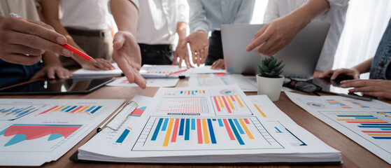 Aufkleber - Focus panorama shot of chart and graph paper with blur analyst team utilize BI Fintech to analyze financial dashboard, brainstorm and analyzing report paper on table for business insight. Scrutinize