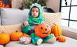© Krakenimages.com - Adorable hispanic boy having halloween party holding sweets at home
