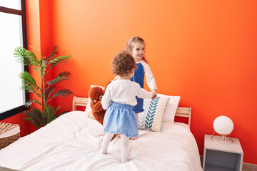 Sticker - Adorable girls smiling confident standing on bed at bedroom