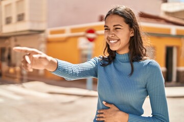 Sticker - Young african american woman smiling confident pointing with finger at street