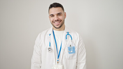 Wall Mural - Young hispanic man doctor smiling confident standing over isolated white background