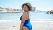 © Krakenimages.com - Young beautiful latin woman tourist smiling confident wearing swimsuit at beach