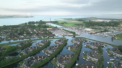 Poster - Aerial of the Wouda pumping station in Lemmer, Netherlands alongside the sea and the green field