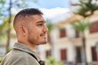 © Krakenimages.com - Young hispanic man smiling confident standing at park