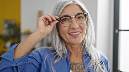 Canvas Print - Middle age grey-haired woman business worker smiling confident at office