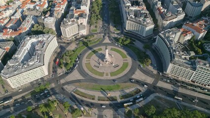 Poster - Drone shot over Marquis of Pombal Square with traffic and building around on a sunny day