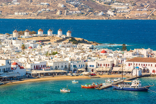 Wall Mural -  - Chora port of Mykonos island with red church, famous windmills, ships and yachts during summer sunny day. Aegean sea, Greece