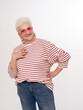 Beautiful senior woman in sunglasses posing in studio