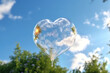 © Dmytro - Soap bubble in the shape of a heart against the sky. Glossy romantic soapy heart. Valentine day symbol. Generative AI