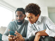 © Lumos sp - father son child family smartphone man teenage phone boy parent technology together lifestyle mobile phone communication teenager mobile sitting togetherness young fun