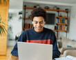 © Lumos sp - education laptop student computer teenager studying boy learning homework study young school teenage black technology happy internet sitting college online man notebook using