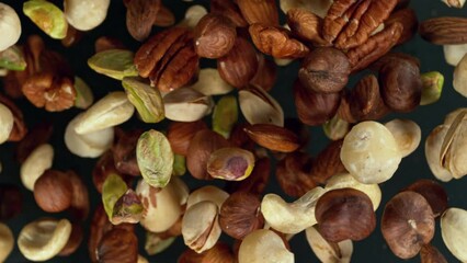 Poster - Super Slow Motion of Rotating Mix Nuts up to the Air. Filmed on High Speed Cinema Camera, 1000fps, Placed on High Speed Cine Bot.