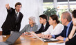 © JackF - Angry male boss reprehending colleagues on meeting in modern office