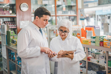 skilled pharmacist is consulting, analyzing the use of drugs to recommend and supervise patients according to prescriptions in modern pharmacies.