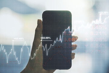 Aufkleber - Abstract creative financial graph and hand with mobile phone on background, financial and trading concept. Multiexposure