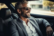 © AI_images - Attractive elegant happy man in good car.