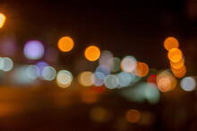 Bokeh Background Of The Shop Lamps And Street  Light In The Night Out Of Focus