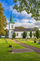 Canvas Print - Gravel path to a church in the countryside