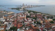 Aerial Of Colonial Old Town Of Cartagena With The Modern Skyscrapers In The Background, Bolivar, Colombia. Drone Dolly Back Shot