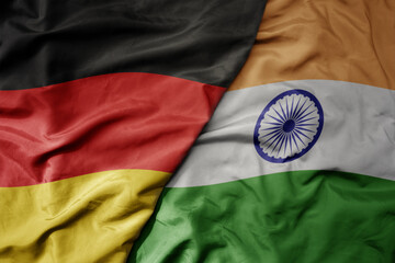 Wall Mural - big waving realistic national colorful flag of germany and national flag of india .