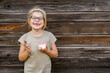 © Irina Schmidt - Little adorable preschool girl with eyeglasses eating berry and watermelon ice cream sundae in cup on sunny summer day. Happy child eat icecream dessert. Sweet food on hot warm summertime days