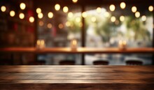 This Stunning Coffee Shop Photograph Featuring A Cozy Shelf And Table Setup, Perfect For A Cafe Or Restaurant Decor. The Bokeh Effect In The Background Adds A Touch Of Magic To The Scene