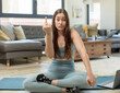 young adult woman practicing yoga feeling angry, annoyed, rebellious and aggressive, flipping the middle finger, fighting back
