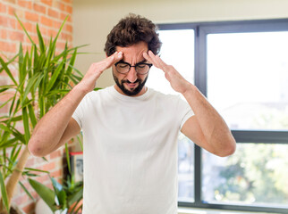 Wall Mural - young adult crazy man with expressive pose at a modern house interior