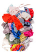 © smirart - Used clothes in a pile. Sorting second-hand for recycling. Copy space on white background. Top view