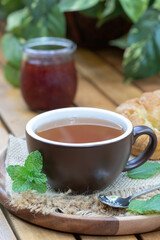 Sticker - Cup of tea with mint, croissant and jar of jam