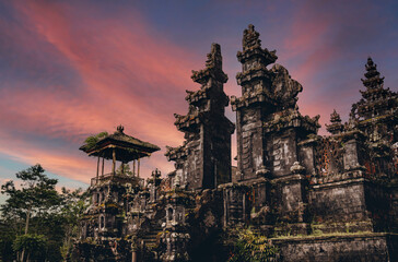 magnific landscape view of besakih temple with fiery beautiful sky. sacred balinese temple with trad