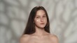 © kinomaster - Attractive young girl with long hair and makeup with a cream on her face