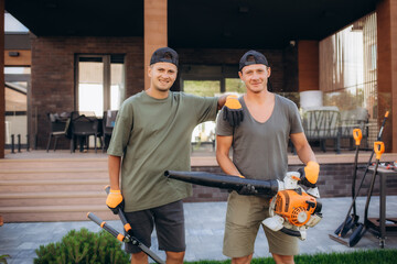 portrait of two gardeners in the yard