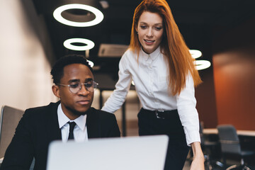 Sticker - Multiethnic businesspeople working on netbook in office