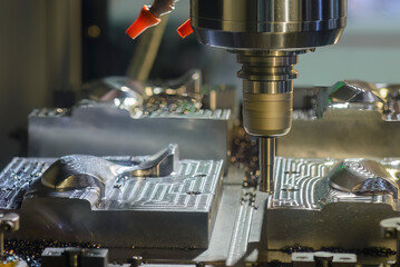 The CNC milling machine rough cutting the injection mold parts by indexable tools.