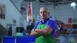 © Marco - Serious Supermarket Manager with Arms Crossed, Concerned Expression of Older Small Business Owner Inside Store