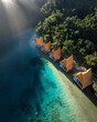 © AmazingAerialAgency - Aerial view of luxury resort overwater bungalow along the coast of Bucas Grande Island, Surigao del Norte, Philippines.
