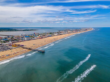 Aerial View Of People On The Beach And Pier In Ocean City, Maryland, United States.